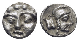 Pisidia. Selge circa 350-300 BC. Obol AR (0.95 Gr. 10mm.) 
Gorgoneion. 
Rev. Head of Athena to right, wearing crested Attic helmet; behind, astragalos...