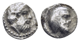 Cilicia. Nagidos circa 400-380 BC. Obol AR (0.58 Gr. 9mm.)
Head of Pan right 
Rev. Bearded head of Dionysos right.