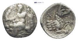Lycaonia, Laranda AR Obol (Silver, 9mm, 0.53 g) 4th century BC Obv: Baaltars seated left, holding grain ear, grapes and sceptre. Rev: Forepart of wolf...
