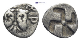 TROAS, Kebren. Late 6th-early 5th centuries BC. AR Obol (8mm, 0.4 g). Ram heads back to back, facing upward; floret between; [K]EBP around / Incuse sw...