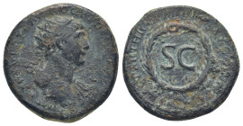 Syria, Trajan. AD 98-117. Æ As (23mm, 9.0 g). Rome mint, for circulation in Syria. Struck AD 116. Radiate and draped bust right / S • C within oak wre...