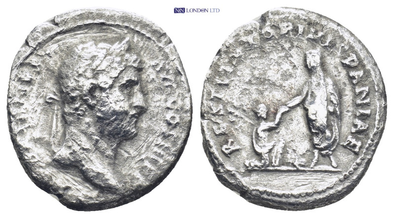 Hadrian. AD 117-138. AR Denarius. Restitutor series. Rome (2.88 Gr. 19mm.)
 Laur...