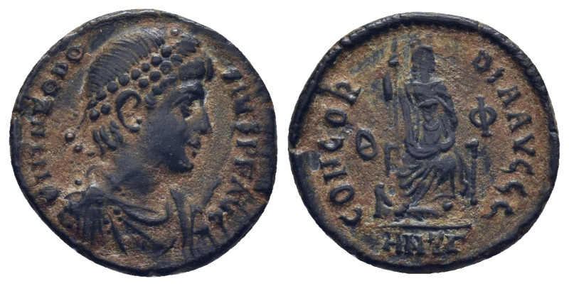 Theodosius I. AD 379-383. AE. Nummus. Antioch. (2.7 Gr. 18mm.)
Pearl diademed, d...