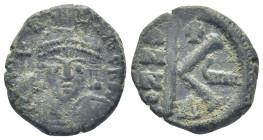 Justinian I AE 20 Nummi. Theoupolis (Antioch) (5.4 Gr. 20mm. )
Helmeted and cuirassed bust facing, holding globus cruciger and shield; cross in right ...