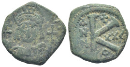 Justinian I AE 20 Nummi. Theoupolis (Antioch) (9.9 Gr. 21mm. )
Helmeted and cuirassed bust facing, holding globus cruciger and shield; cross in right ...