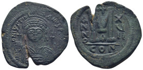 Justinian I Æ 40 Nummi. (38mm, 20.44 g) Constantinopolis, Year 17 = 543/44.Helmeted and cuirassed facing bust, holding globus cruciger and shield; cro...