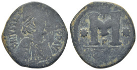 Justinian I. 527-565. Æ Follis (29mm, 14.3 g). Antioch, 533-537. D N IVSTINIANVS PP AVG, diademed and draped bust right / Large M, cross above, star o...
