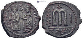 Phocas. 602-610. Æ Follis (27mm, 10.9 g). Theoupolis (Antioch) mint. Dated RY 1 (602/3). Phocas, holding globus cruciger, and Leontia, holding crucifo...