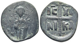 Michael IV, 1034 - 1041 AD AE Follis (9.4 Gr. 31mm.)
 Christ facing raising hand and holding Book of Gospels, IC XC across fields.
 Rev. Large jeweled...
