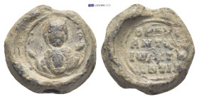 Byzantine lead seal (14mm, 4.0 g) Facing bust of the Virgin Mary, orans, wearing chiton and maphorion, bearing a medallion with a facing bust of the i...