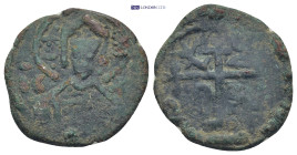 Crusader States, Edessa (County). Joscelin I or II Æ Follis. (23mm, 4.25 g) 1119-1150. Nimbate and crowned bust, holding book of Gospels and cross; un...