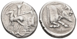 Sicily, Gela. AR, Tetradrachm. 17.17 g. -26.00 mm. Circa 465-450 BC.
Obv.: Charioteer, holding kentron and reins, driving quadriga left; in background...