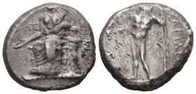 Cilicia, Nagidos. AR, Stater. 10.5 g. - 21 mm. Circa 420-385 BC.
Obv.: Aphrodite, draped to the waist, seated to left, on a throne with a broad top ra...