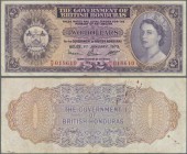 British Honduras: 2 Dollars 1973 P. 29c, pressed, folds and stain in paper, minor pinholes, no tears, condition: F.