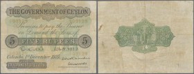 Ceylon: 5 Rupees 1925 P. 22, used with folds and stain in paper, minor center tear, no large tears or repairs, still nice colors, condition: F-.