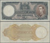 Fiji: 5 Shillings 1938 P. 37b, used with light folds in paper but no holes or tears, still crispness left in paper, not washed or pressed, condition: ...