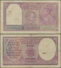 India: 2 Rupees ND(1943) P. 17b, rarely seen with RED TYPE serial number, used with folds and stain in paper, pinholes, conditoin: F-.