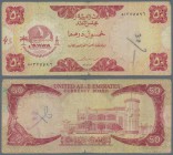 United Arab Emirates: 50 Dirhams ND(1973), P.4, one of the key notes of this series in used condition with graffities, several folds and tiny tear at ...