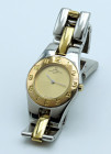 BAUME & MERCIER -Lady- Referenza 5261. Numero di serie 23XXXXX. Movimento al quarzo. Cassa in acciaio con ghiera placcata in oro giallo con diametro d...