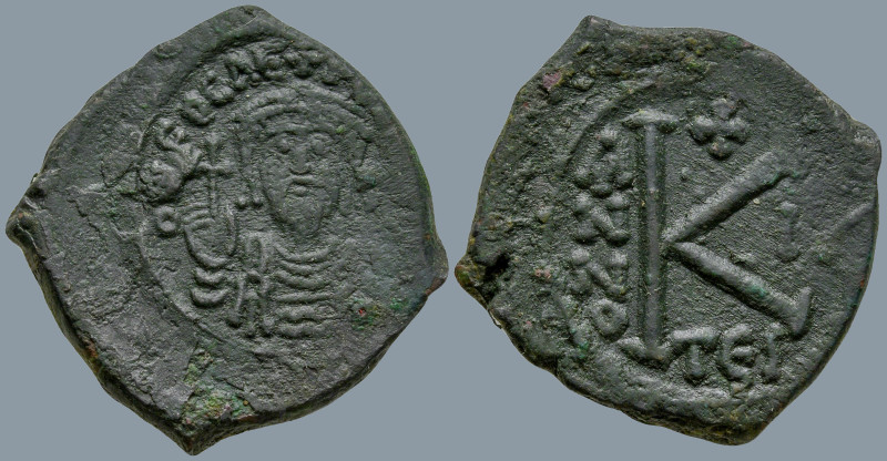 Phocas (602-610 AD). Thessalonica
AE Half Follis (23.5mm 6.09g)
Obv: d m FOCA ...