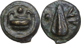 Greek Italy. Umbria, Tuder. AE Cast Uncia. Sleeping dog series, c. 220-200 BC. Obv. Two handled vase; above, pellet. Rev. Spearhead; to right, TV; to ...