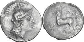 Greek Italy. Northern Apulia, Arpi. AR Diobol, c. 325-275 BC. Obv. Head of Athena right, wearing Attic helmet decorated with hippocamp; symbol on neck...