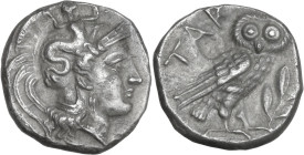 Greek Italy. Southern Apulia, Tarentum. AR Drachm, c. 302-280 BC. Obv. Head of Athena right, wearing helmet decorated with Scylla. Rev. TAP. Owl stand...