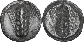 Greek Italy. Southern Lucania, Metapontum. AR Nomos, c. 540-510 BC. Obv. ΜΕΤΑ (retrograde) to right. Ear of barley with seven grains. Rev. Incuse ear ...