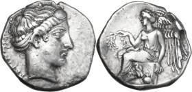 Greek Italy. Bruttium, Terina. AR Stater, 420-400 BC. Obv. TEPINAION. Head of nymph Terina right. Rev. Nike seated left on cippus, holding wreath and ...