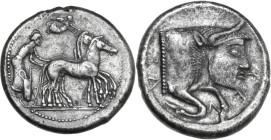 Sicily. Gela. AR Tetradrachm, c. 485-470 BC. Obv. Charioteer, looking back, driving fast quadriga right; above flying Nike crowning horses. Rev. CΕΛΑΣ...
