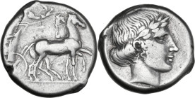 Sicily. Katane. AR Tetradrachm, c. 445-435 BC. Obv. Charioteer driving slow quadriga right; above, Nike flying right, crowning horses. Rev. Laureate h...