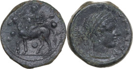 Sicily. Nakona. AE Tetras, c. 5th century BC. Obv. Silenos seated sidesaddle on ass left, holding kantharos and thyrsos; three pellets around. Rev. NA...