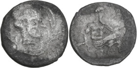 Sicily. Panormos as Ziz. AR Litra, 415-405 BC. Obv. Head of nymph right; four dolphins around. Rev. [ΠAN]. Poseidon seated right on rocks, holding tri...