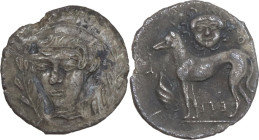 Sicily. Segesta. AR Litra, 415-409 BC. Obv. Head of nymph three-quarter left; flanked by laurel branches. Rev. Hound standing left; to left, murex she...