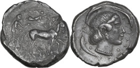 Sicily. Syracuse. Second Democracy (466-405 BC). AR Tetradrachm, c. 450 BC. Obv. Charioteer, holding kentron and reins, driving slow quadriga right; a...