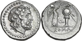 'Q' series. AR Victoriatus, uncertain Apulian mint, 210 BC. Obv. Laureate head of Jupiter right. Rev. Victory standing right, crowning trophy; between...