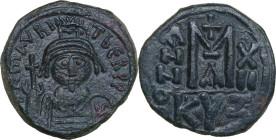 Maurice Tiberius (582-602). AE Follis. Cyzicus mint, dated RY 12 (593/4). Obv. DN MAVRI TBER PP. Crowned, draped and cuirassed bust facing, holding gl...