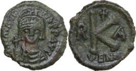 Maurice Tiberius (582-602). AE Half Follis, Ravenna mint. Obv. DN MAVR TIb PP AVC. Draped and cuirassed bust facing, wearing plumed helmet and holding...