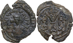 Justinian II (685-695). AE Follis. Struck 685-695. Sardinian mint. Obv. D N IЧSTINIANЧS PP. Bust facing, beardless, wearing crown and chlamys and hold...