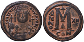 Justinian I, 527-565. Follis Constantinople mint. RY 12 (539/40.) DN IVSTINIANVS PP AVG, helmeted, pearl-diademed and cuirassed bust facing holding gl...