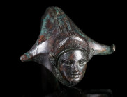A GREEK OR EARLY ROMAN BRONZE HANDLE WITH A GODDESS
Circa 3rd century BC - 1st century AD.
Upper part of an exquisite handle, probably from an oinoc...