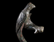 A ROMAN BRONZE JUG HANDLE IN THE FORM OF A PARROT
Circa 1st-2nd century AD.
Finely worked and decorated handle of a jug in the shape of a perching p...