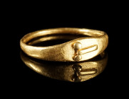 A ROMAN GOLD RING WITH A PHALLUS
Circa 1st-2nd century AD.
Small ring with oval bezel that supports a gold phallus in relief. Probably a child's rin...