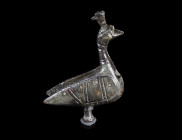 A BYZANTINE BRONZE PADLOCK IN THE SHAPE OF A PEACOCK
Circa 9th-12th century AD.
Figural padlock in the shape of a peacock with folded wings. Decorat...