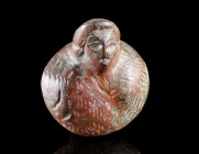 A SMALL ROMAN BRONZE BUST APPLIQUE OF A MALE
Circa 2nd-3rd century AD.
Stylised bust of a male wearing some kind of animal skin. Possibly a represen...