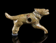 A SMALL ROMAN BRONZE FITTING IN THE FORM OF A DOG
Circa 2nd-3rd century AD.
Probably a belt fitting in the shape of a leaping dog with collar; centr...