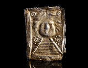A PRE-ROMAN SILVER VOTIVE PLAQUE DEPICTING A GODDESS
Circa 2nd-1st century BC.
Rectangular plaque made of sheet metal, featuring the bust of a godde...