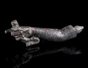 A ROMAN BRONZE RIGHT ARM FROM A STATUETTE 
Circa 1st-2nd century AD.
Right arm, holding an implement/attribute (a bow?) in the hand, with outstretch...