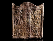 A ROMAN DANUBIAN RIDER LEAD VOTIVE PLAQUE 
Circa 3rd-4th century AD. 
Rectangular ‘Mystery Plaque’ with twisted border and wavy top. In the wavy top...