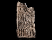 A ROMAN DANUBIAN RIDER LEAD VOTIVE PLAQUE WITH INCISIONS
Circa 3rd-4th century AD. 
Left half of a rectangular ‘Mystery Plaque’ with twisted border....